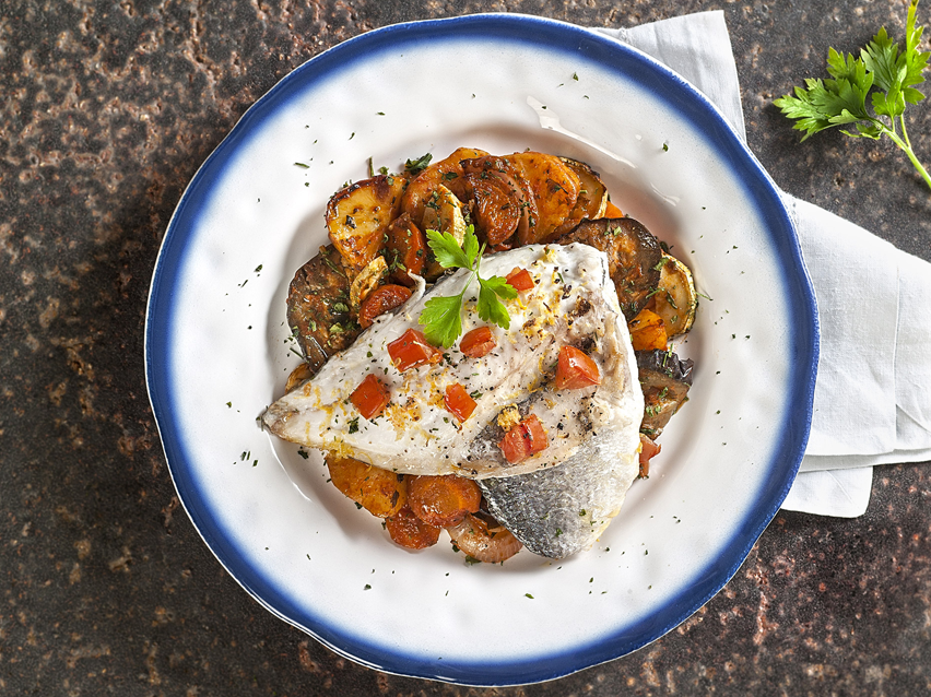 Baked sea bass with roasted vegetables.